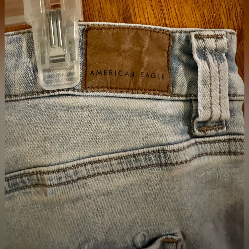 American Eagle flare light colored jeans size 16 distressed look.